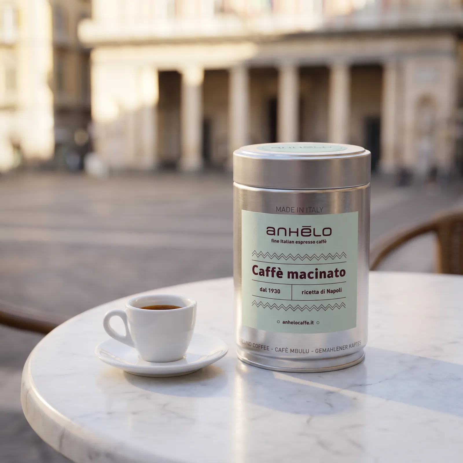 Anhelo ground coffee tin and espresso cup on a marble table in a square