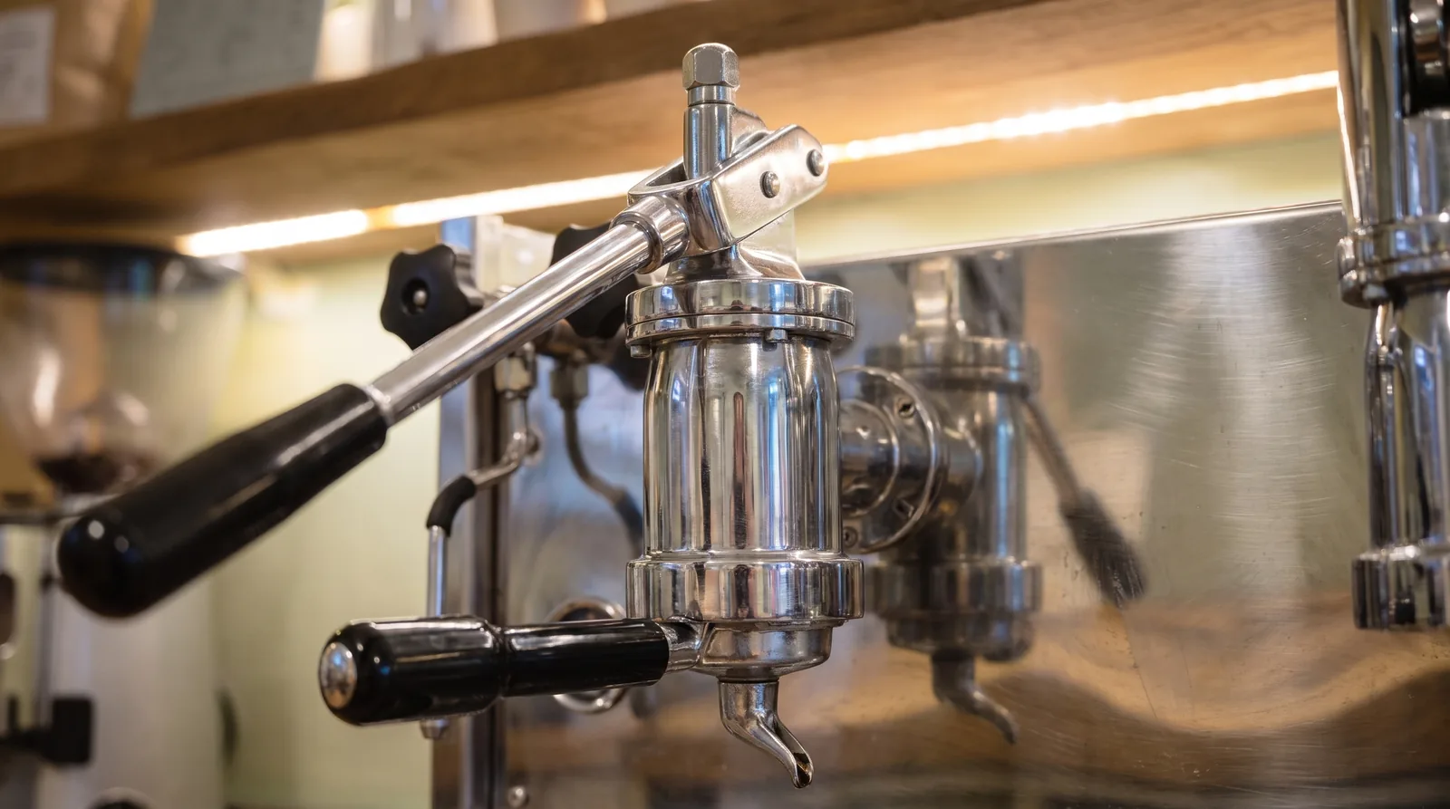 Detail of the lever and group of a professional espresso machine