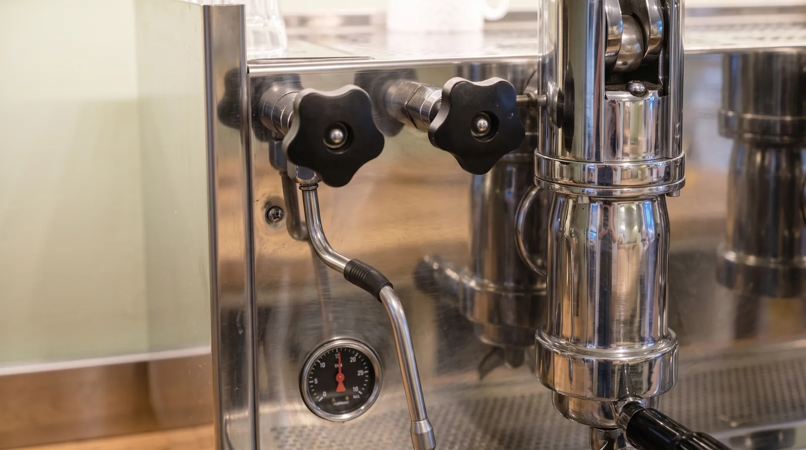 Detail of the pressure gauge and groups of a lever espresso machine