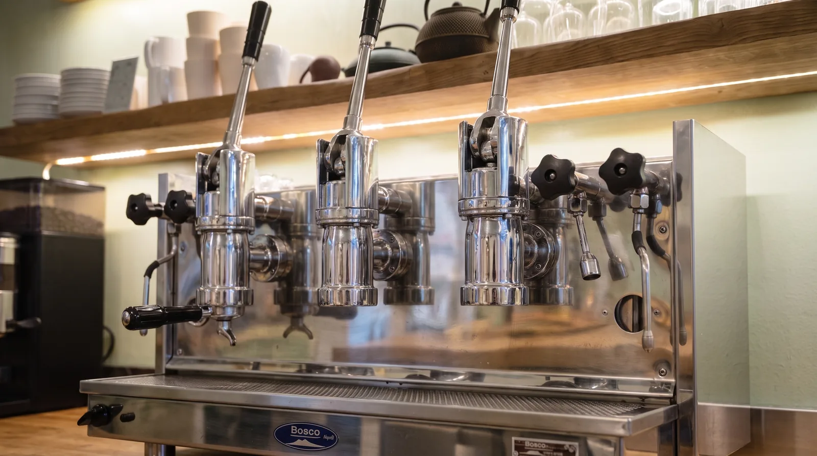 Three-group lever espresso machine in a café