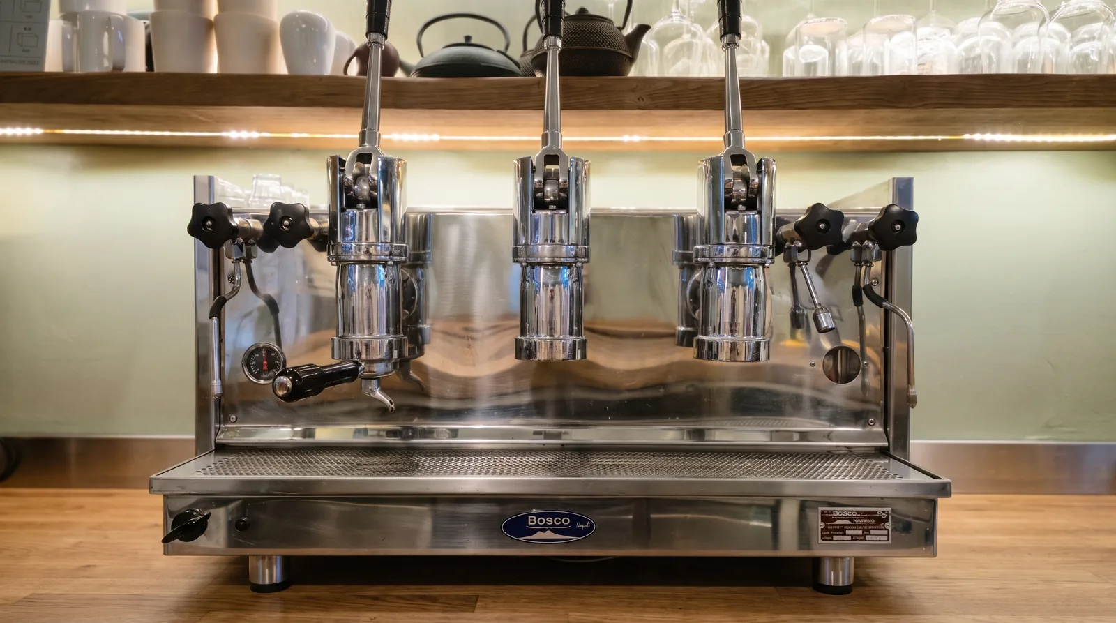 Three-group lever espresso machine in a café